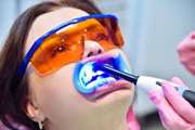 Effect of Three Wavelengths of Diode Laser on the Efficacy of Bleaching of Stained Teeth 
